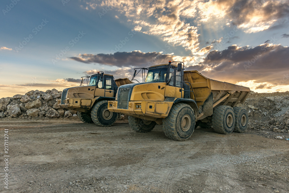 Large trucks in an open pit mine Large trucks in an open pit mine