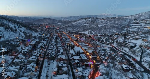 Incredible aerial drone shot taking off up and over Park City, Utah at dusk photo