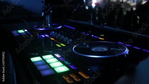 Dj playing on pioneer controller photo