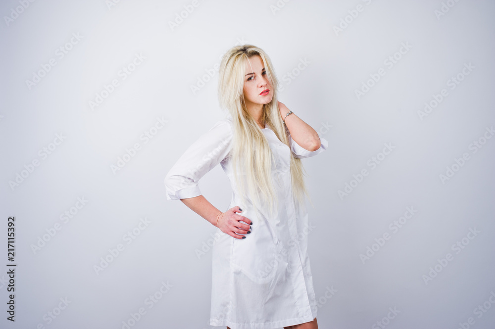 Attractive blonde female doctor or nurse in lab coat isolated on white background. Attractive blonde female doctor or nurse in lab coat isolated on white background.
