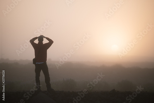 Man tourist meets dawn in Iceland