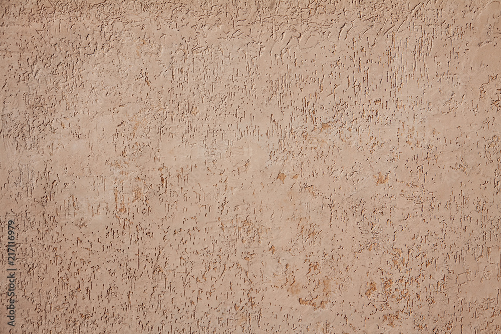 Fototapeta premium Beige cement plaster wall as background or texture.