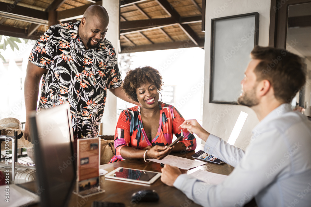 Obraz premium Guests checking in to a hotel