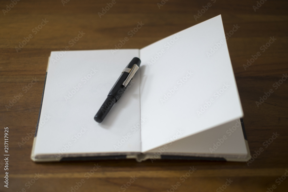 old style notebook with a fountain pen old style notebook with a fountain pen