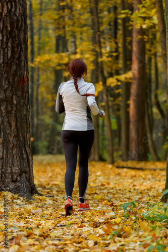 Picture from back in full growth of brunette in forest