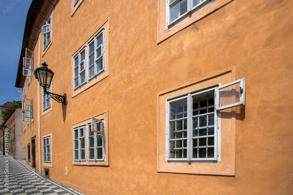 Old orange house on the street of Prague