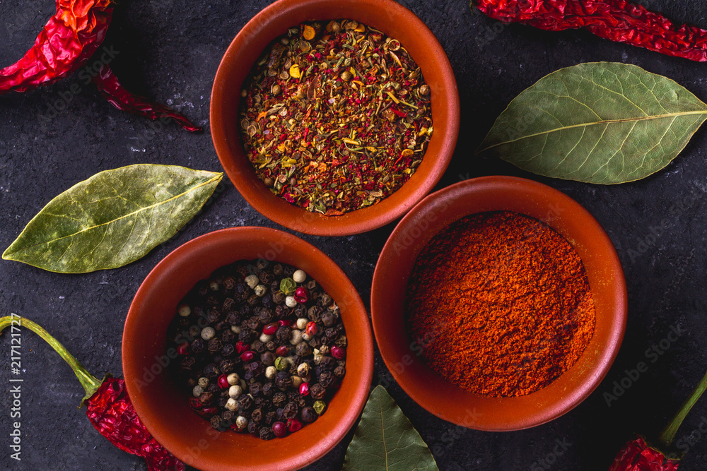 Spicy, tasty, spices and red, dried pepper on a dark background