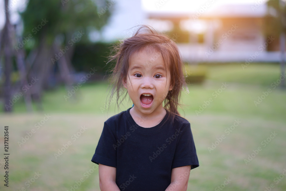 Cute asian thai girl kid playing in playground, portrait Cute asian thai girl kid playing in playground, portrait