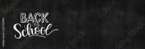 Back to school chalk doodle background on blackboard