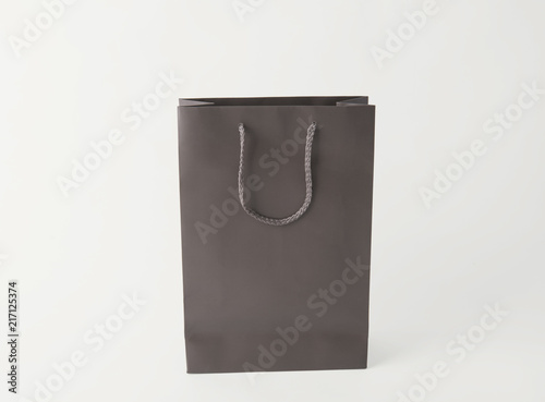 Blank gray paper shopping bag for mockup template advertising and branding background.