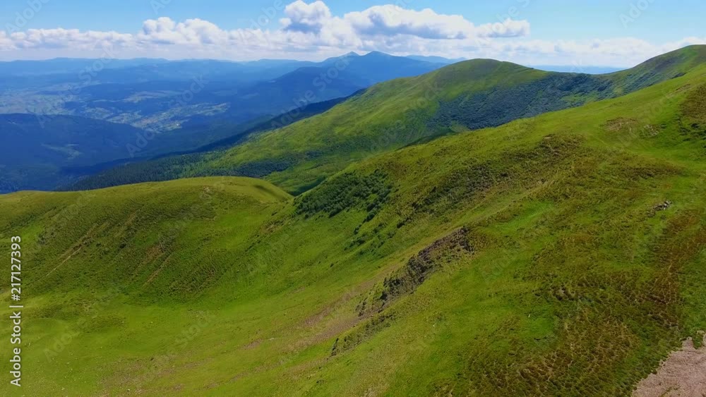 Aerial shot of a slanting slope with ground lanes in the Carpathians in summer Aerial shot of a slanting slope with ground lanes in the Carpathians in summer