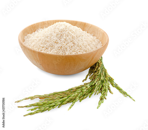 white rice (Thai Jasmine rice) in wooden bowl and unmilled rice isolated on white background
