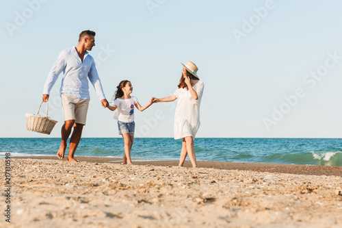 Young family having fun together at the beach.