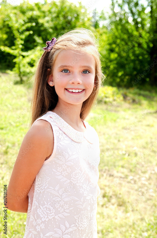 Portrait of adorable smiling little girl child outdoors Portrait of adorable smiling little girl child outdoors