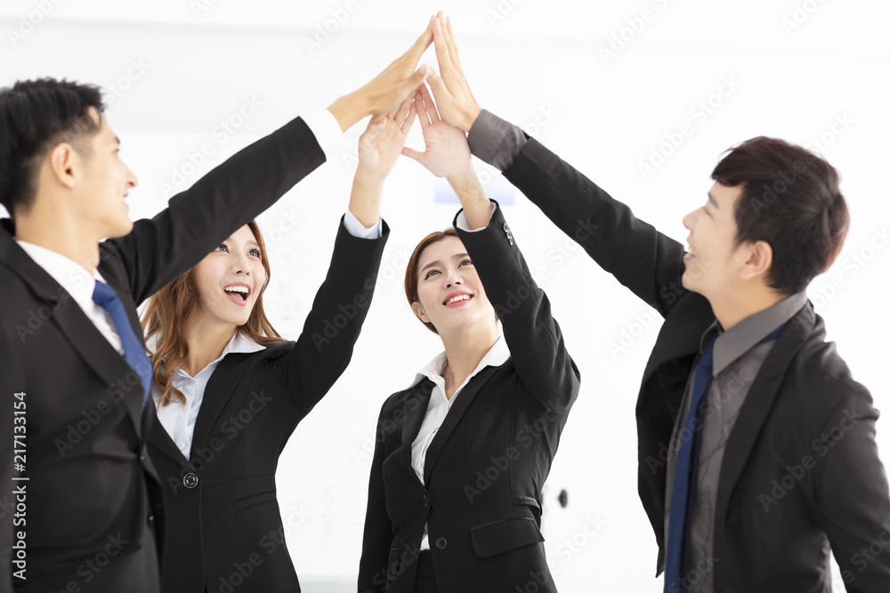 successful business team giving a high fives gesture successful business team giving a high fives gesture