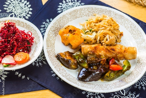 Beetroot salad and fried vegetable with noodle. photo