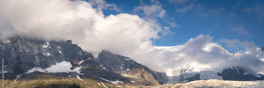 a panoramic view of the aguille du mid and mont blanc overlooking chamonix during summer in the french alpws