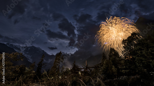 Fotografija Fireworks in the woods and mountains night landscape