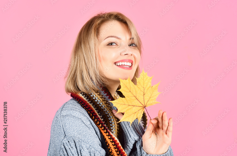 Autumn. Autumn portrait of smiling woman with maple leaf. Autumn mood. Sensual woman with autumn leaf. Yellow maple leaf. Woman holds leaf in hand. Copy space. Isolated. Autumn. Autumn portrait of smiling woman with maple leaf. Autumn mood. Sensual woman with autumn leaf. Yellow maple leaf. Woman holds leaf in hand. Copy space. Isolated.