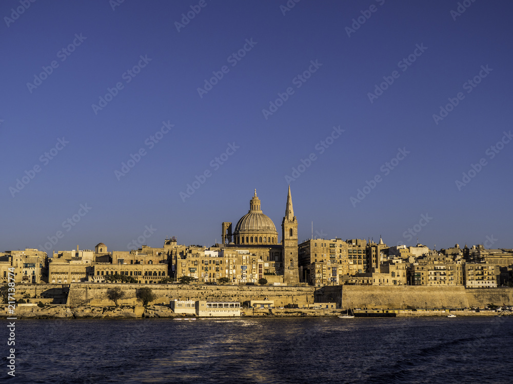 Skyline of Valletta Old Town from the Harbour during sunset hour