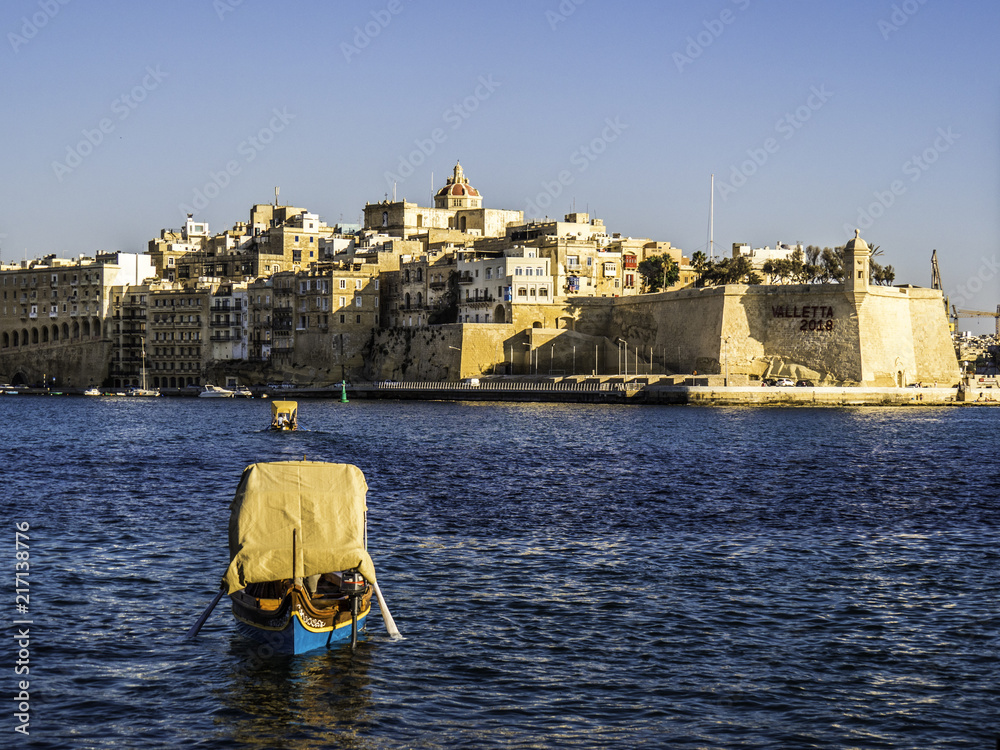 Skyline of Valletta Malta view from the harbour during sunset hour