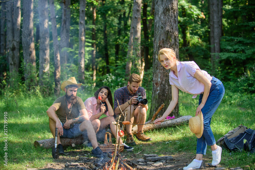 Company friends having hike picnic nature background. Summer picnic. Tourists hikers relaxing while having picnic snack. Picnic with friends in forest near bonfire. Hikers relaxing during snack time Company friends having hike picnic nature background. Summer picnic. Tourists hikers relaxing while having picnic snack. Picnic with friends in forest near bonfire. Hikers relaxing during snack time
