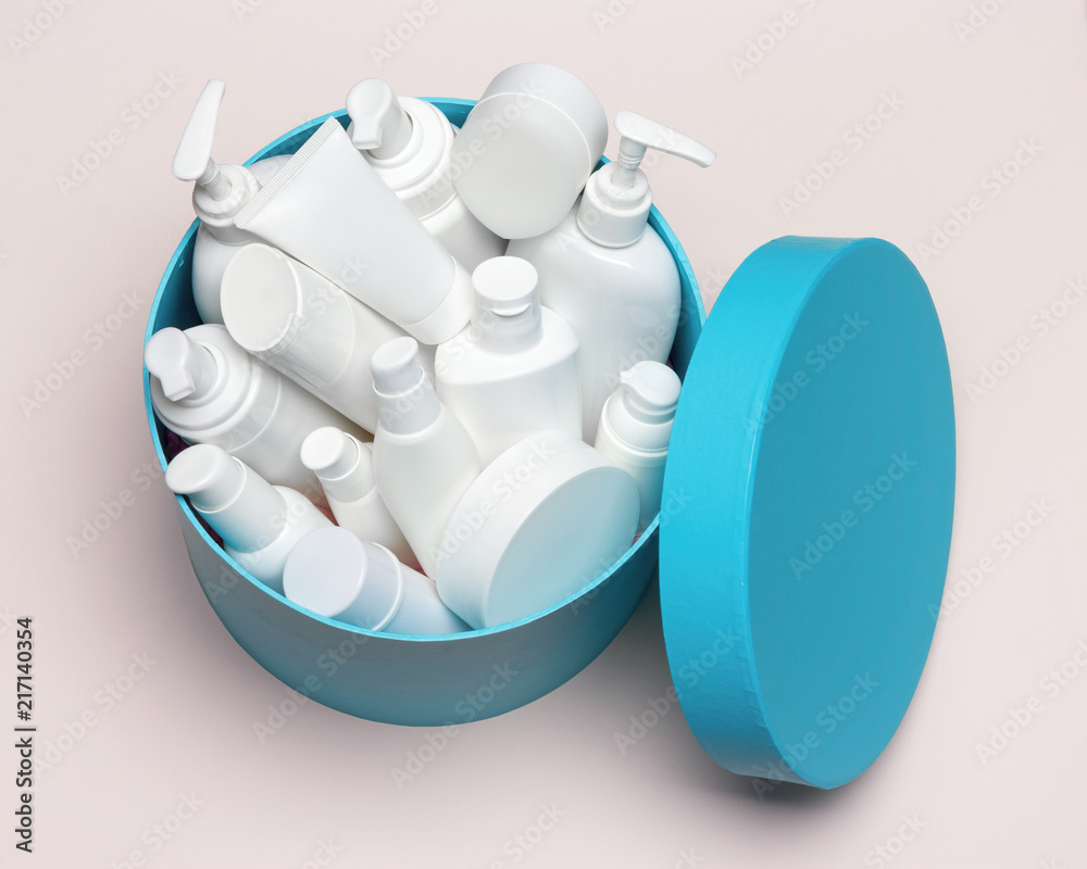 Open large round gift box filled with different cosmetic products Open large round gift box filled with different cosmetic products
