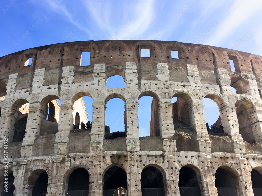 The Colosseum on a light sky background. is a beautiful and majestic ancient amphitheater, the largest building of the ancient world.