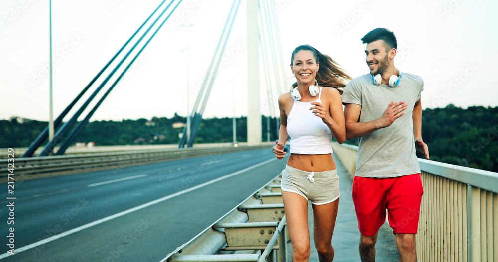 Attractive man and beautiful woman jogging together Attractive man and beautiful woman jogging together