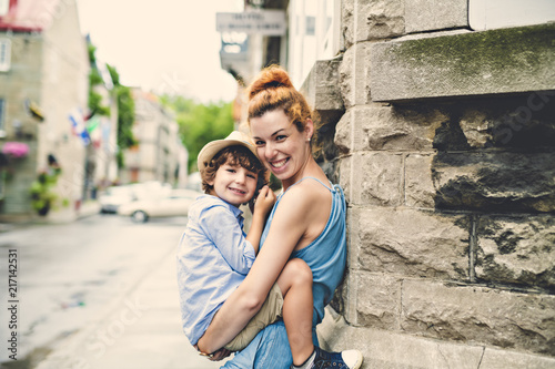 Mother with her son outside in an urban street