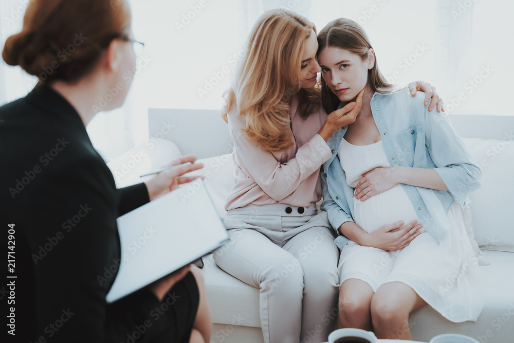 Mother with Pregnant Daughter in Doctor Office. Mother with Pregnant Daughter in Doctor Office.