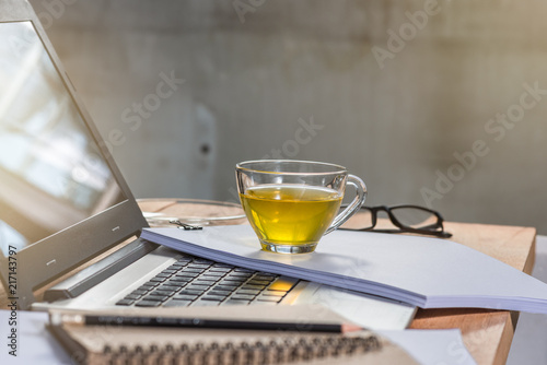 a cup of tea on blank document, break and relax time after working