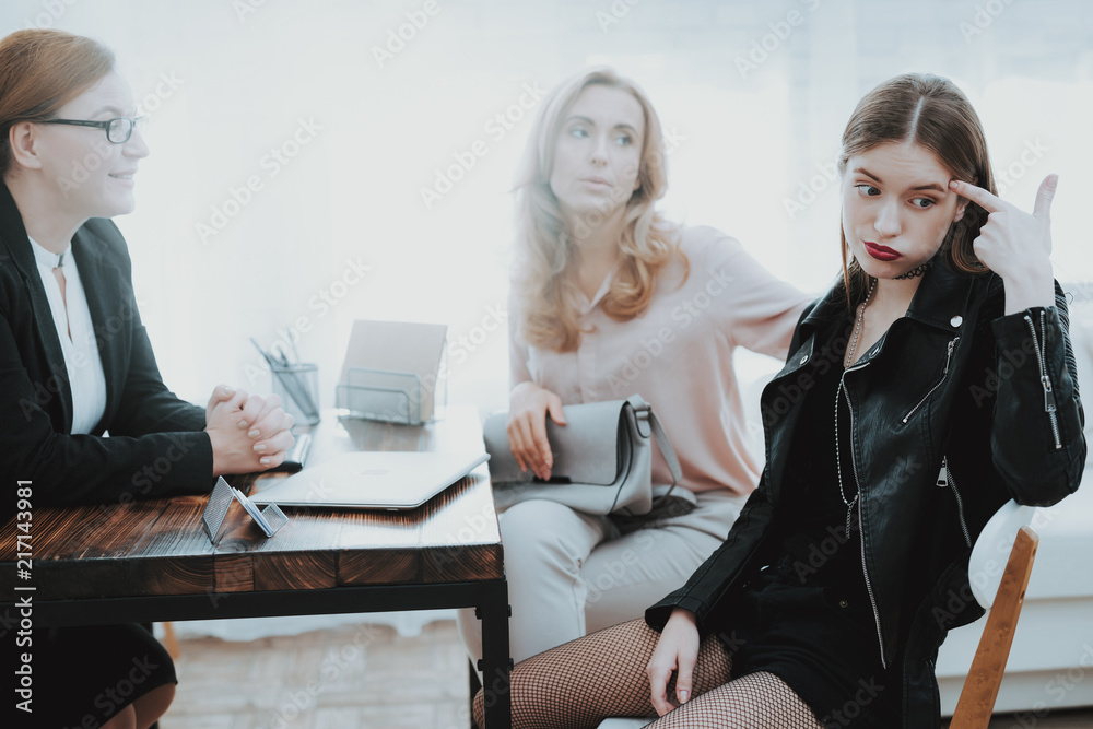 Upset Daughter in Jacket in Psychologist Office. Upset Daughter in Jacket in Psychologist Office.