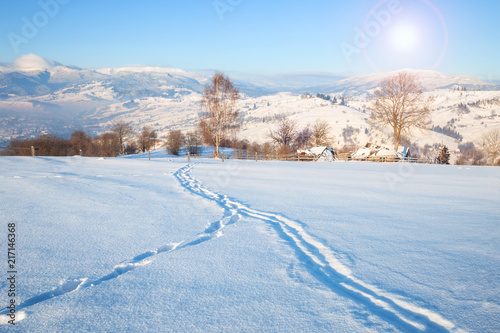 Beautiful winter nature landscape, amazing mountain view of sunset. Scenic image of snowy woodland.