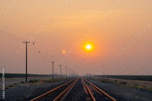 train track desert sunset