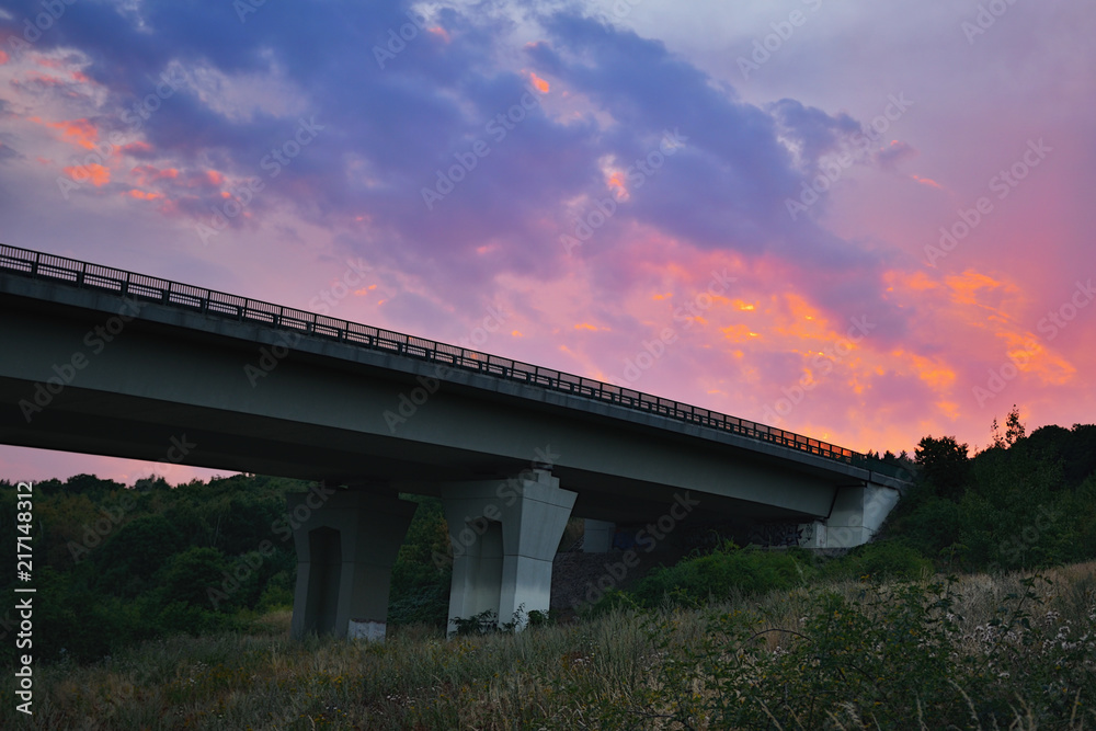 Chomutov, Czech republic - July 27, 2018: colorful sky above D8 highway bridge near Chomutov city after sunset in summer evening