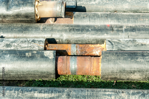 City district heating pipes with insulation welted together for new hot water pipeline system close up selective focus photo