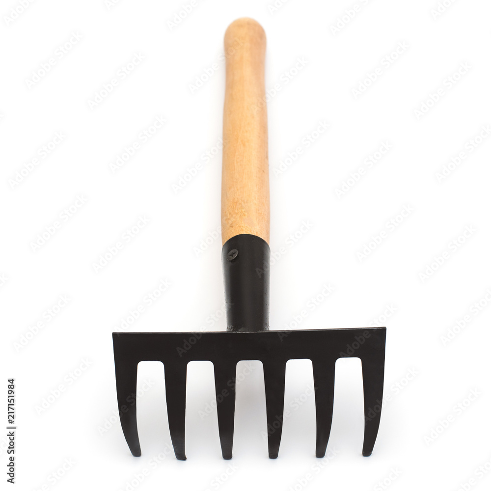Garden small rake for garden work isolated on white background. Flat lay, top view Garden small rake for garden work isolated on white background. Flat lay, top view