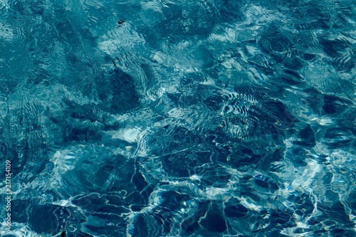 A close view of the waves in a swimming pool water.