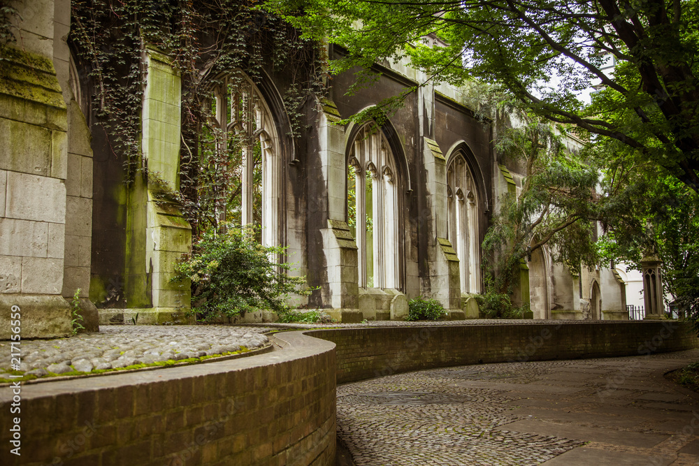 A beautiful old church transformed into public park in London. Landscape with a historic architecture.