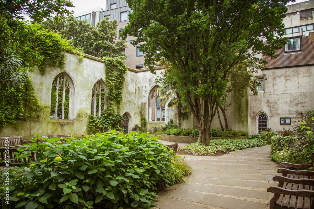 A beautiful old church transformed into public park in London. Landscape with a historic architecture.