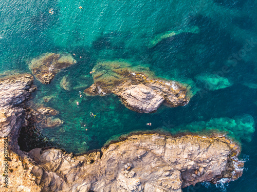 People Snorkling at Cabo de Palos, Spain, Murcia, Cartagena, Summer 2018. Volcanic mounts that form a small peninsula, drone arial shoot from drone