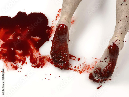 Feet in spilled blood photo