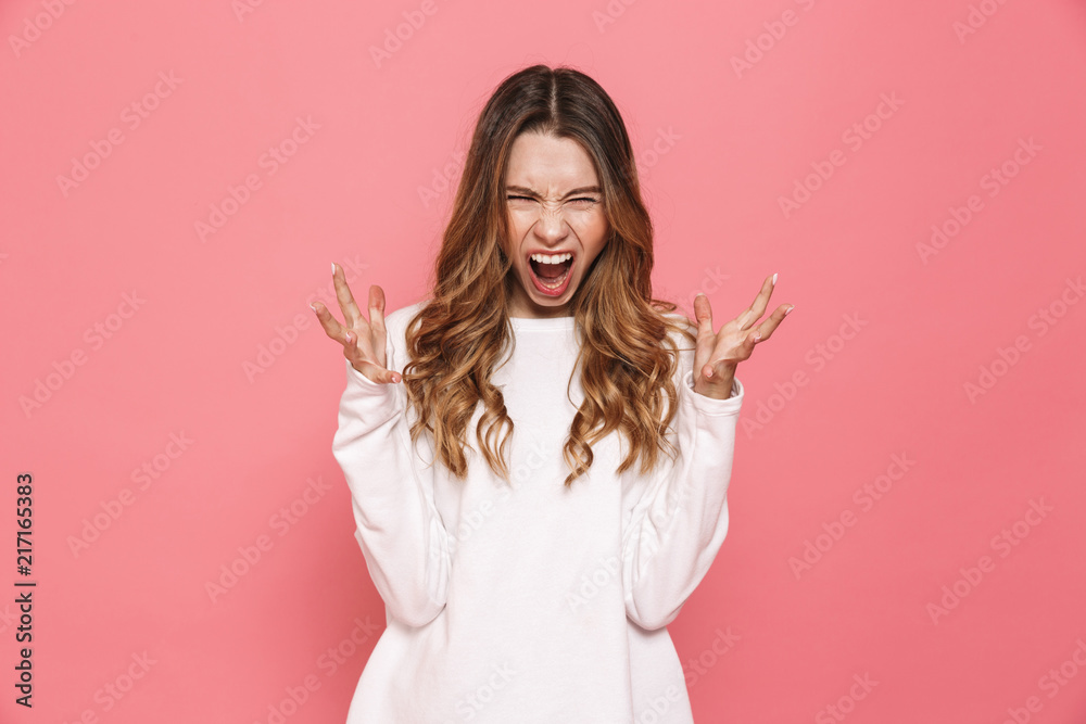 Portrait of a furious young casual girl screaming Portrait of a furious young casual girl screaming