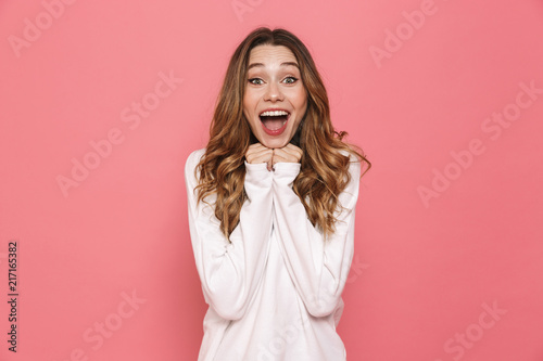 Portrait of an excited young casual girl screaming