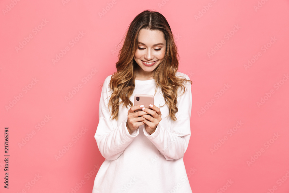 Portrait of a happy young woman using mobile phone Portrait of a happy young woman using mobile phone