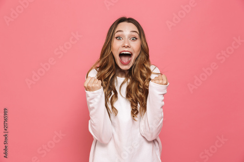 фотографія Portrait of a happy young casual girl screaming