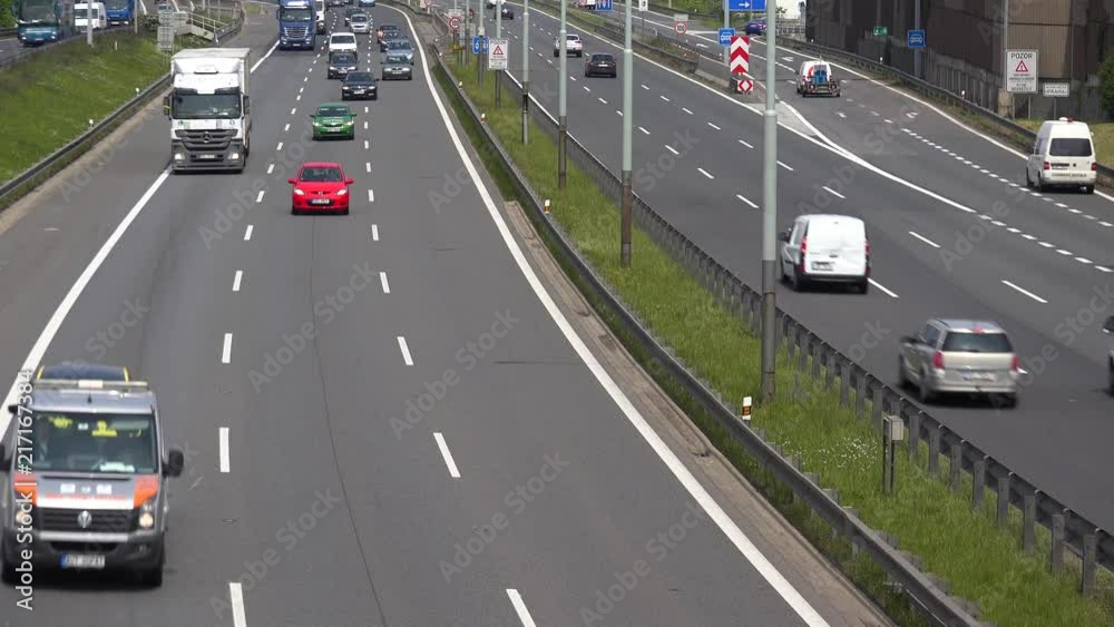 Cars drive up and down the highway - top view Cars drive up and down the highway - top view