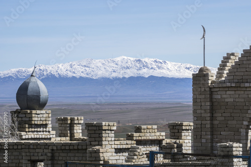 Kazakhstan, Muslim cemetery with Mountains in background