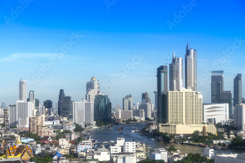 cityscape of Bangkok city skyline with blue sky background, Bangkok city is modern metropolis of Thailand and favorite of tourists © lukyeee_nuttawut